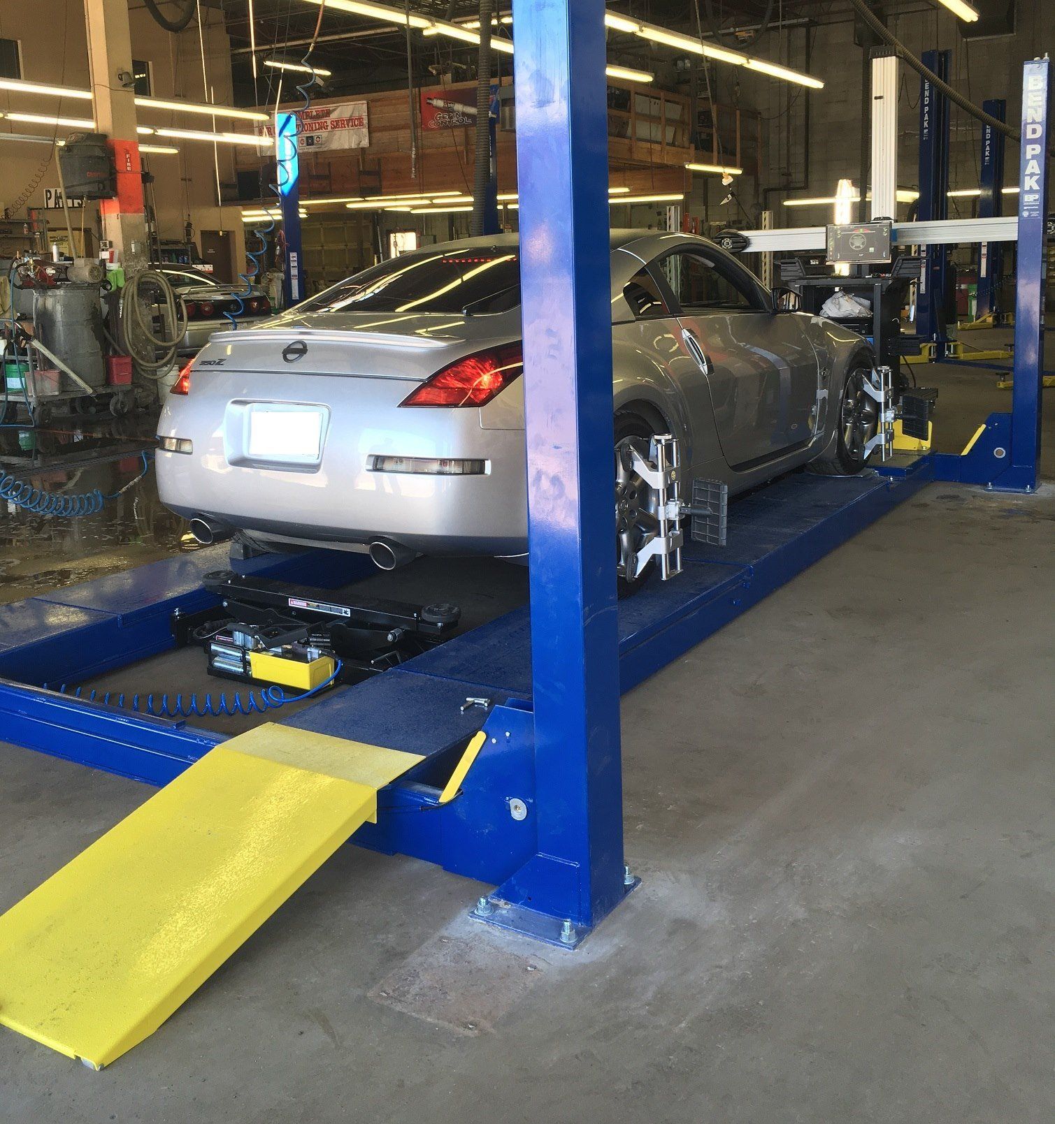 black car repair station with soft-focus and over light in the background