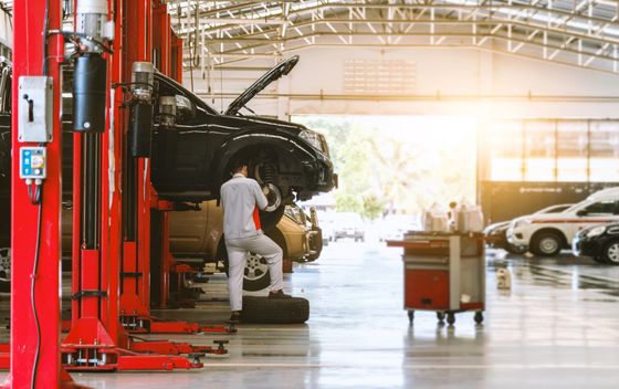 black car repair station with soft-focus and over light in the background