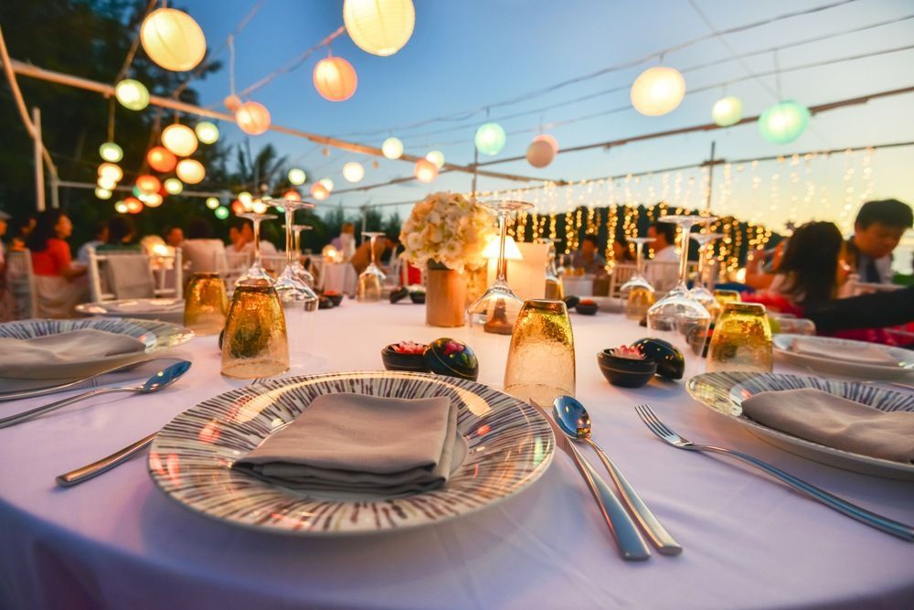 A Table Set for a Wedding Reception With Plates , Glasses , and Silverware — Tuncurry Washerteria In Harrington, NSW