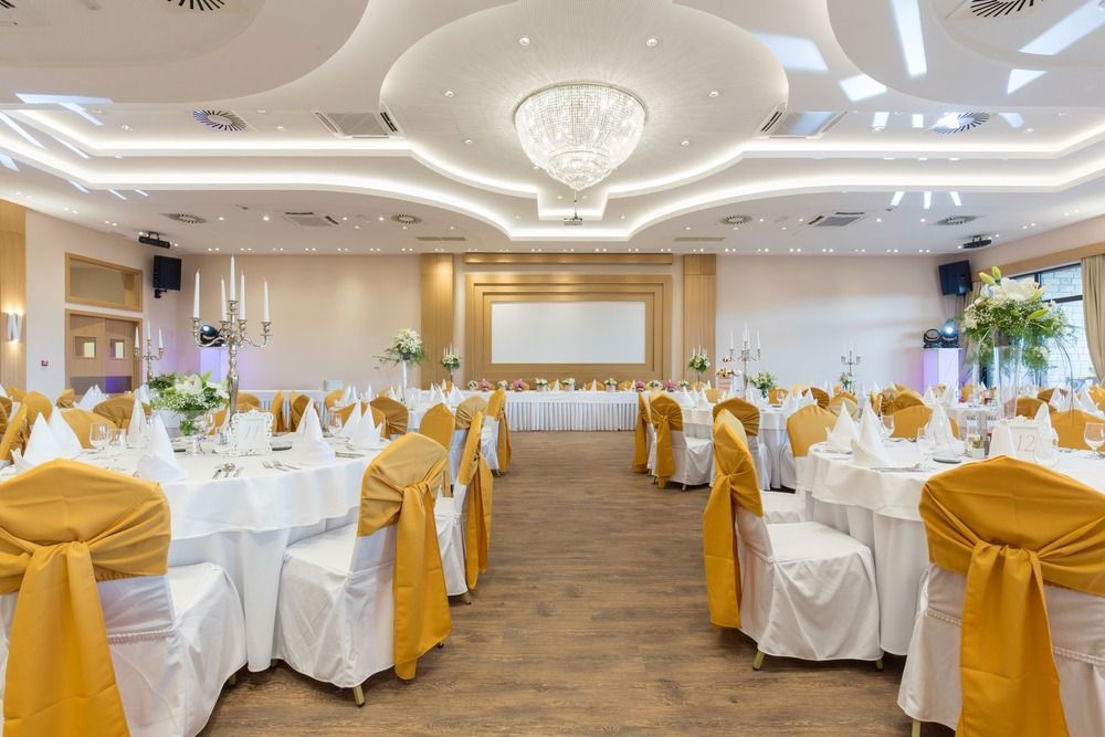 A Large Room With Tables and Chairs Set Up for a Wedding Reception — Tuncurry Washerteria In Forster, NSW