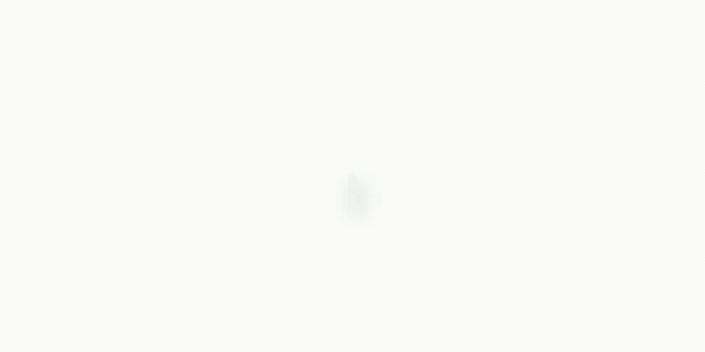 Mostly blank white screen with a faint small gray spot near the center