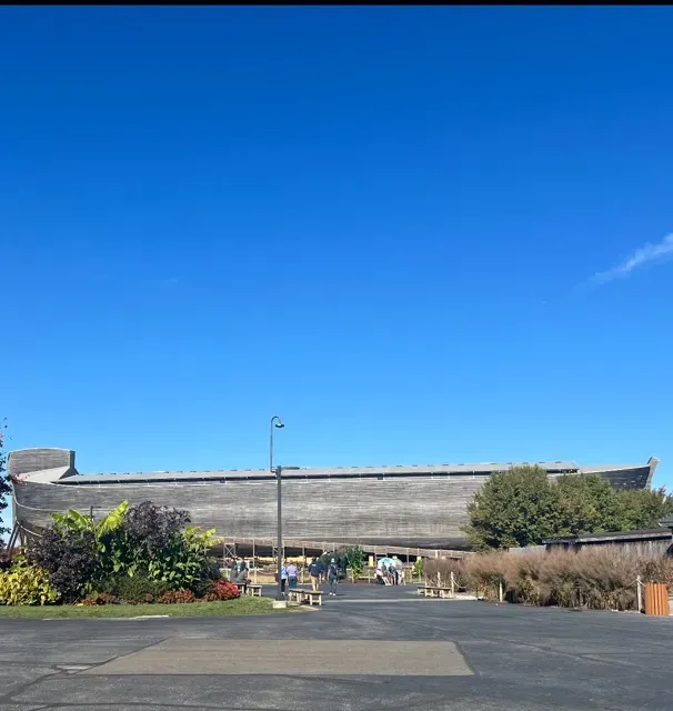 A large building with a blue sky in the background