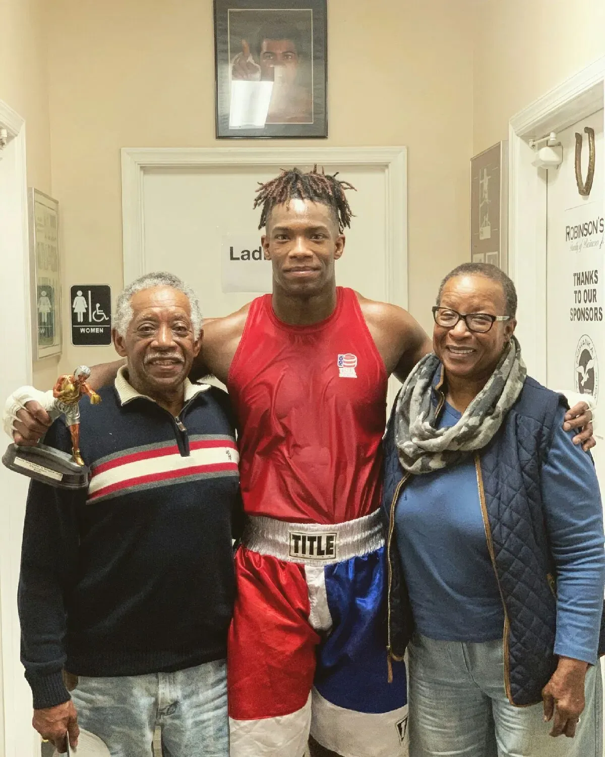 A man in boxing shorts with the word title on it