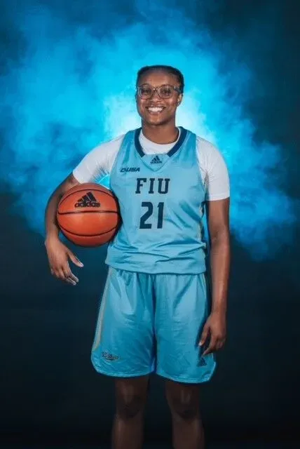 A female basketball player with the number 21 on her jersey