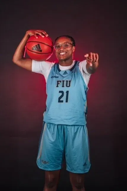 A female basketball player with the number 21 on her jersey