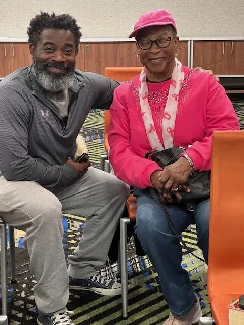 A man and a woman are posing for a picture