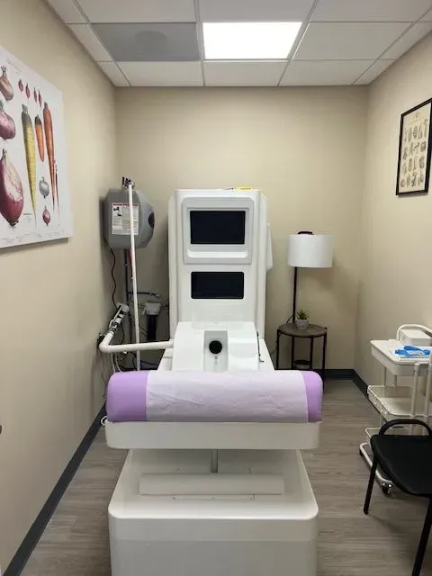 A room with a chair and a machine in it