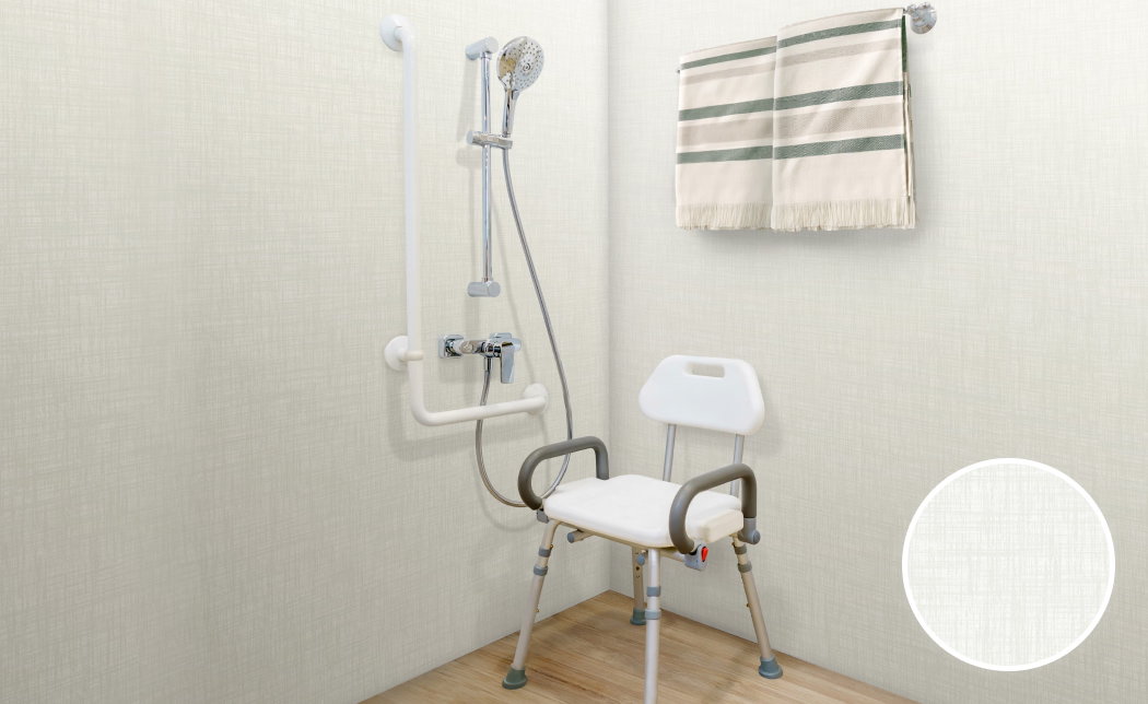 A bathroom with a shower chair and a towel hanging on the wall.