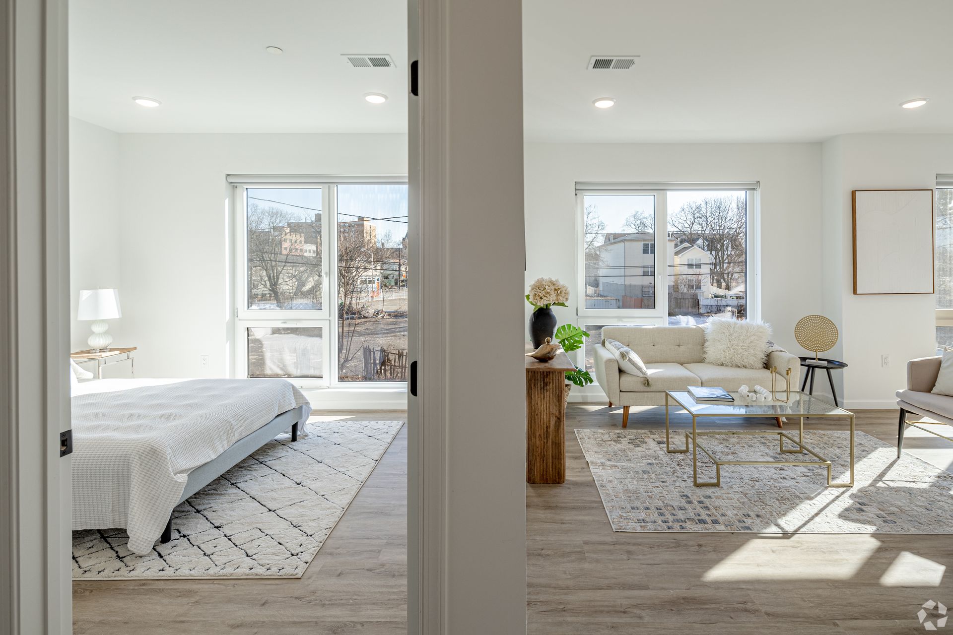 A bedroom and living room are connected by a door.- The Unity