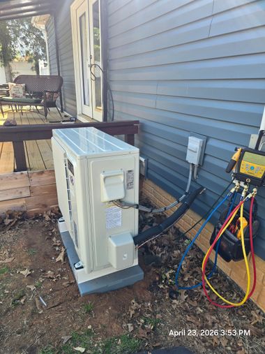 Open electrical panel with exposed wiring, terminals, and circuit components inside a metal box.