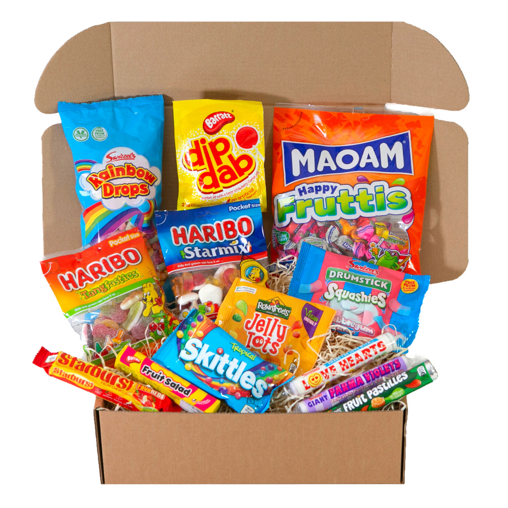 A box filled with a variety of candy including skittles and haribo