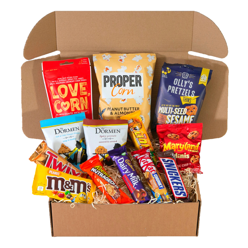 A box filled with a variety of snacks including m & m 's and snickers