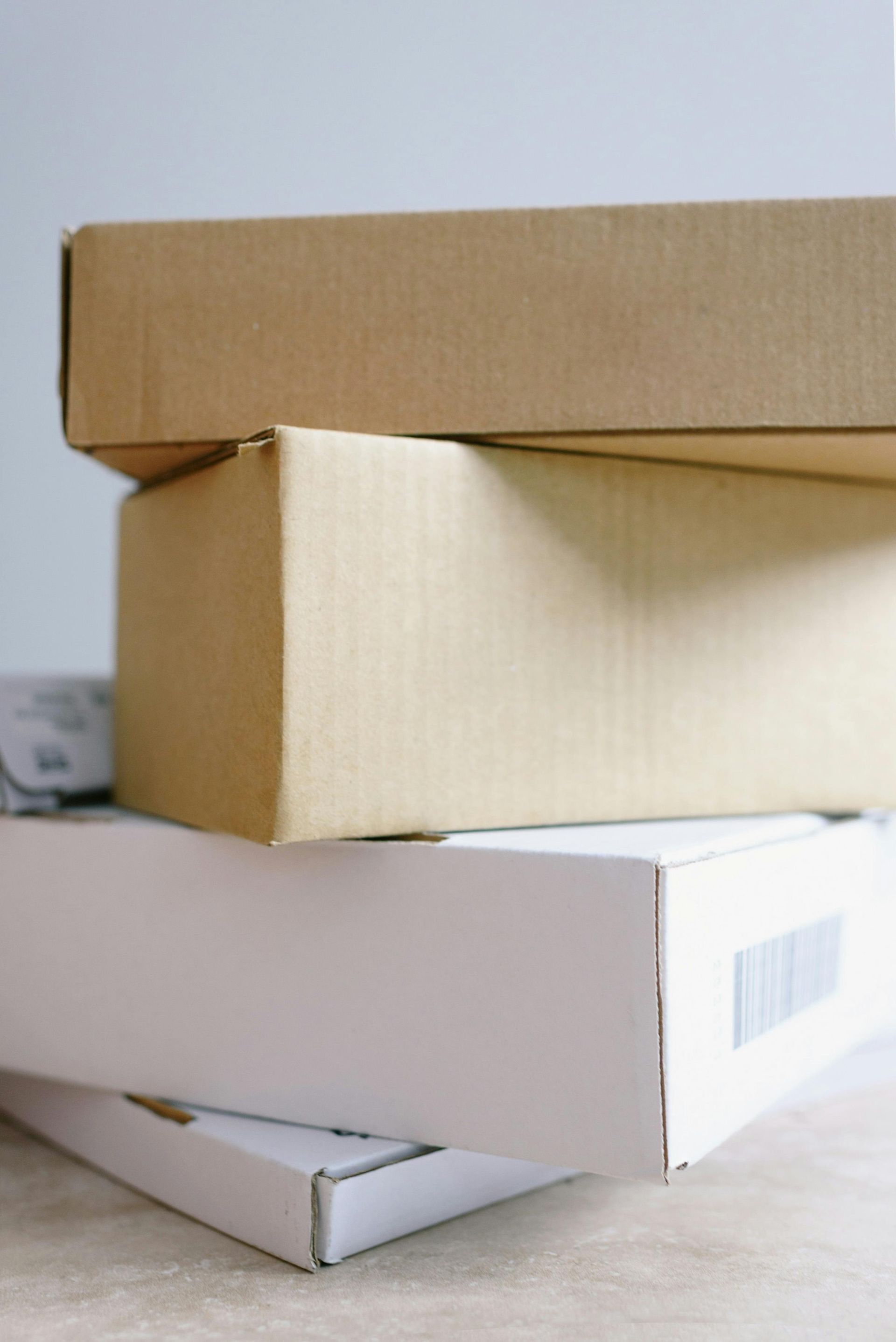A stack of cardboard boxes sitting on top of each other on a table.