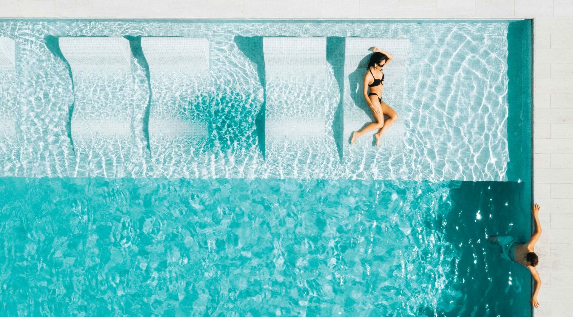 Tanning ledges are one of the perfect concrete pool feature to add