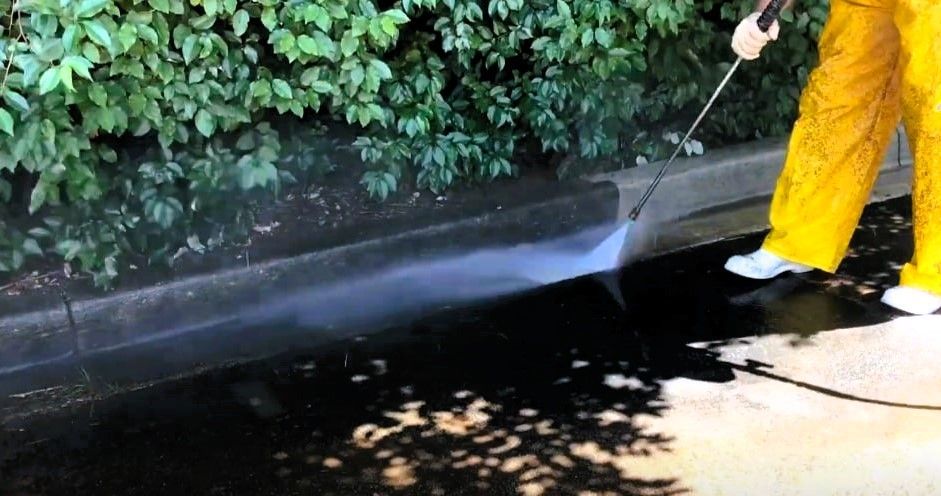Professional cleaning and maintaining curb and gutter.
