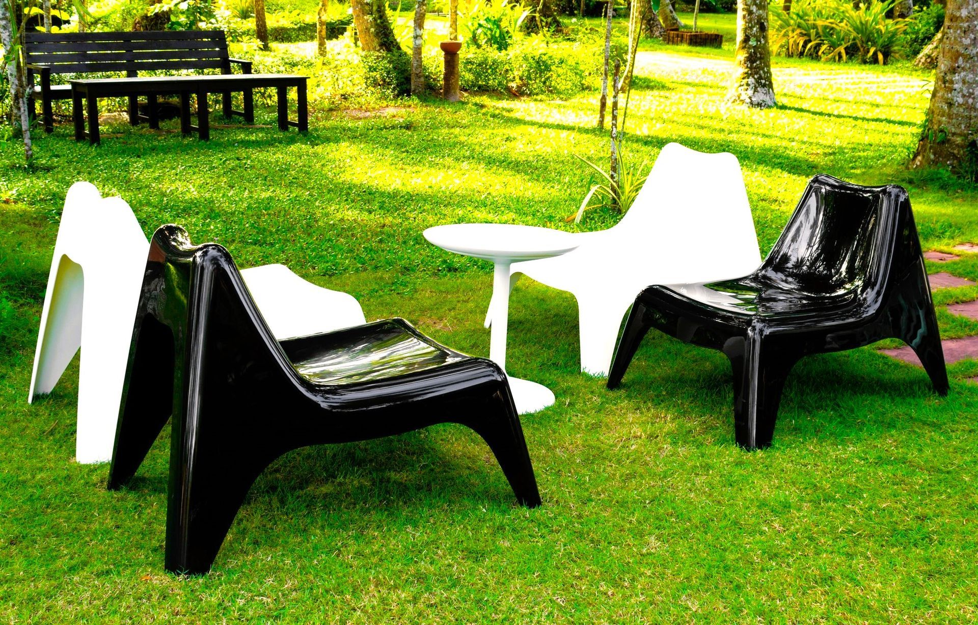 Plastic chairs in a garden, can be used as molds for concrete.