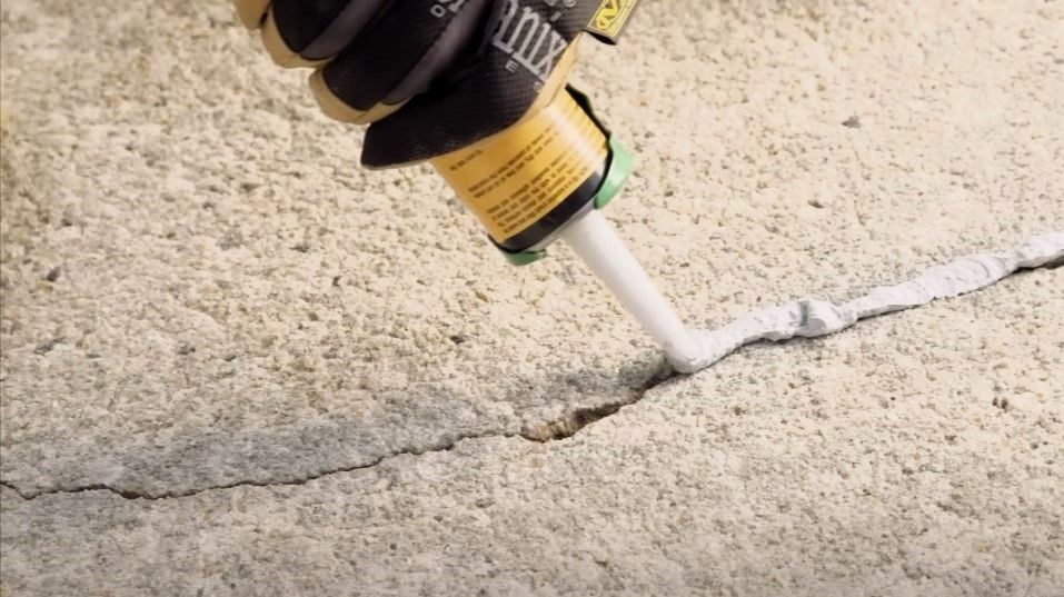 Repairing cracks in concrete using a crack filler