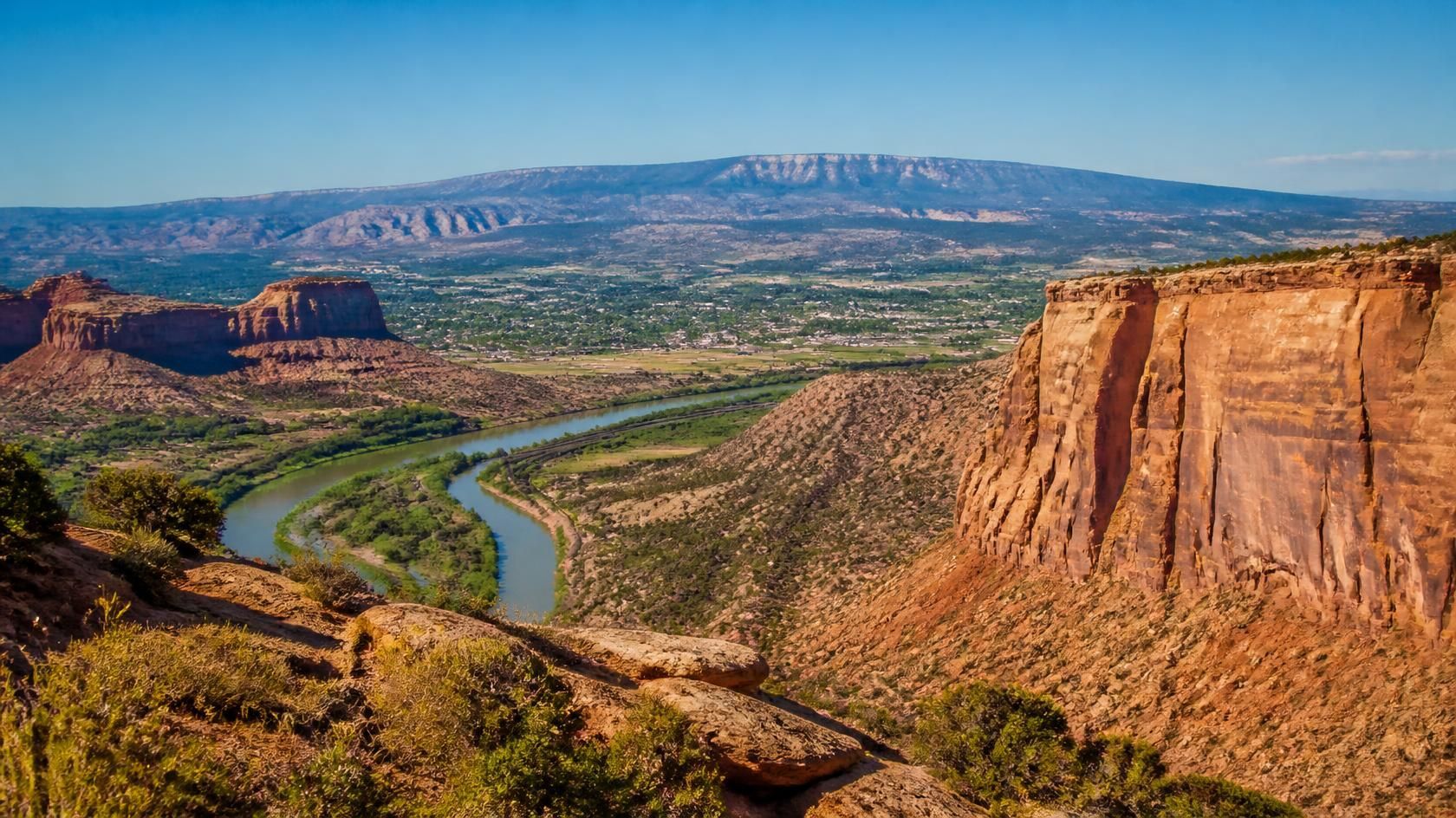 Things to do in Grand Junction, CO with scenic Colorado River and red rock cliffs