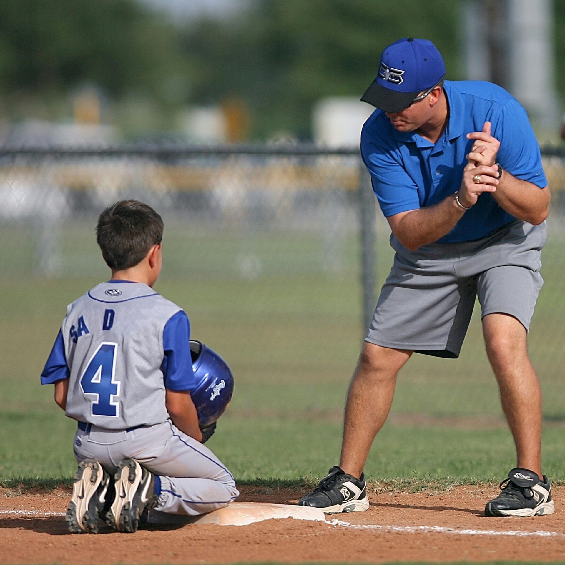 Baseball on a dark surface, with visible stitching.