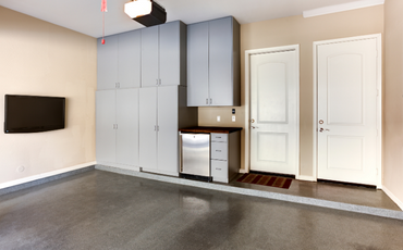 neutral colored garage with epoxy flooring