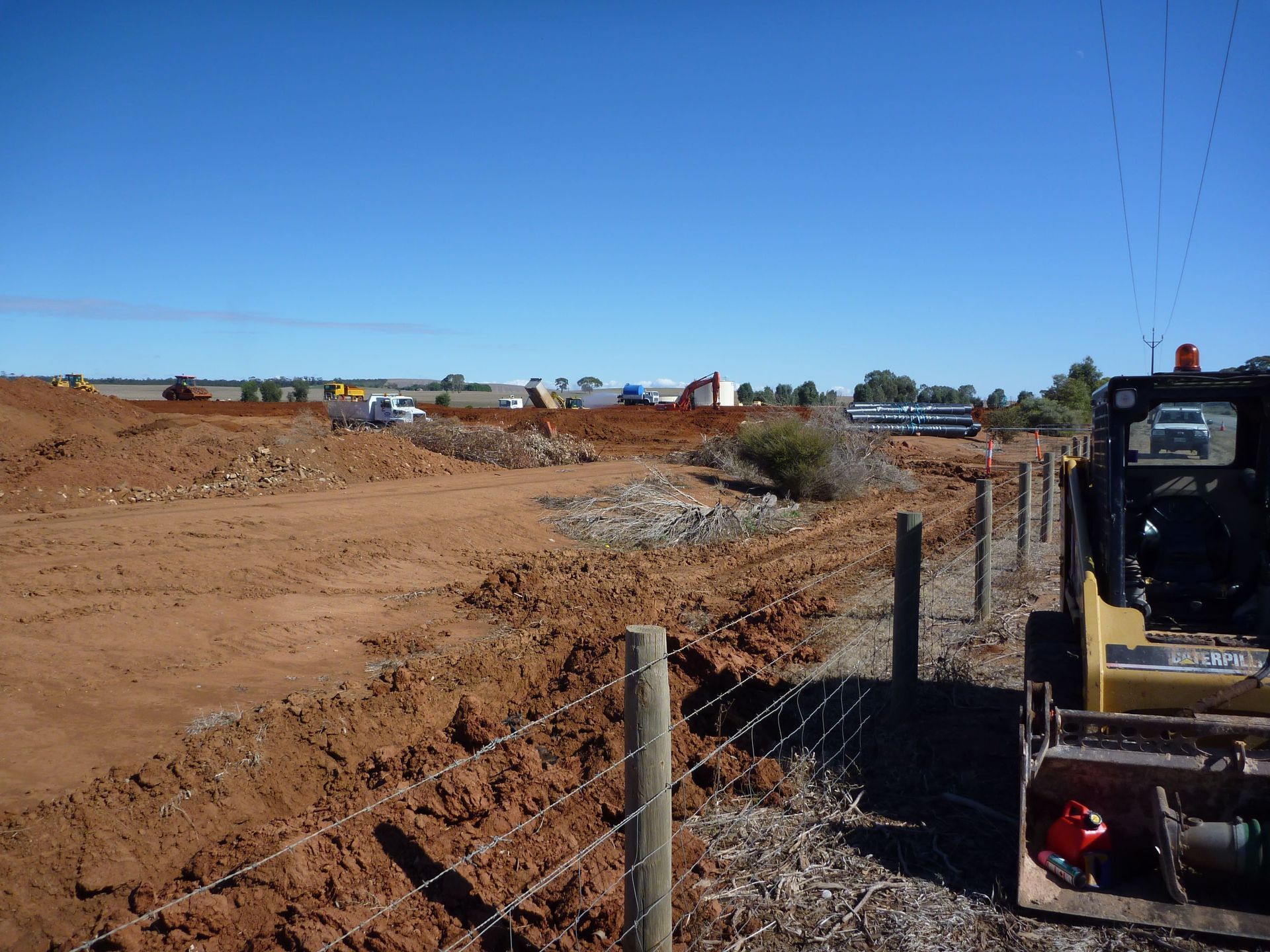 A yellow caterpillar bulldozer is parked in a dirt field | Murray Bridge, SA | Ridleys SA