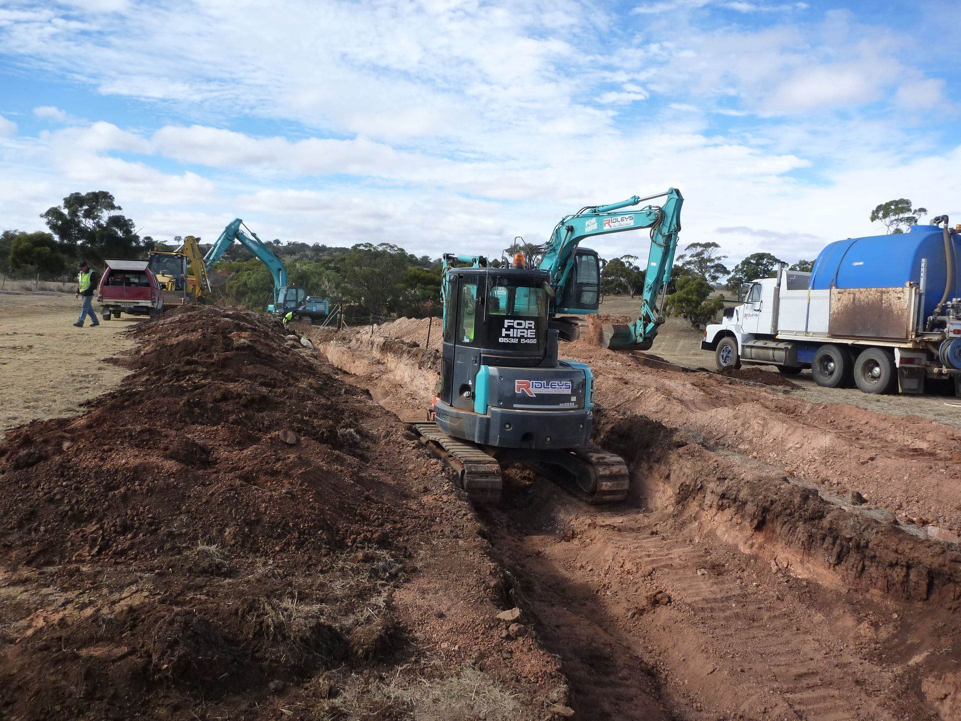 A large pile of dirt is being excavated by a kobelco excavator | Murray Bridge, SA | Ridleys SA