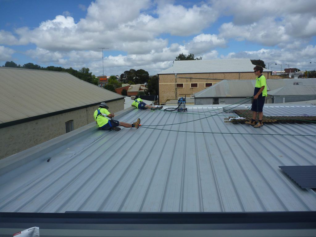 A group of men are working on the roof of a building | Murray Bridge, SA | Ridleys, SA 