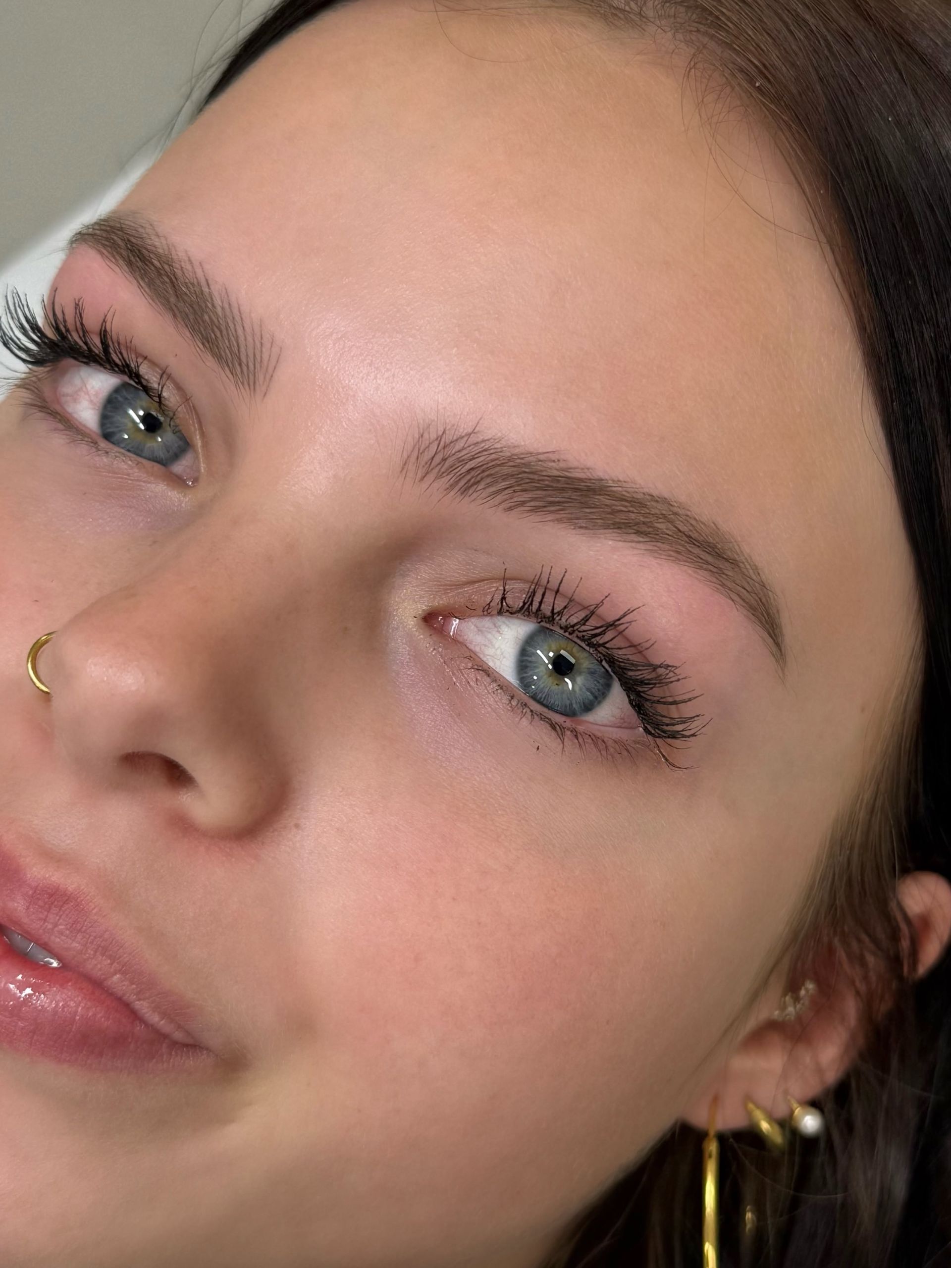 Close-up of a Person With Blue Eyes and Tattooed Eyebrows — Sibina Cosmetic Tattoo Art In Broadbeach, QLD