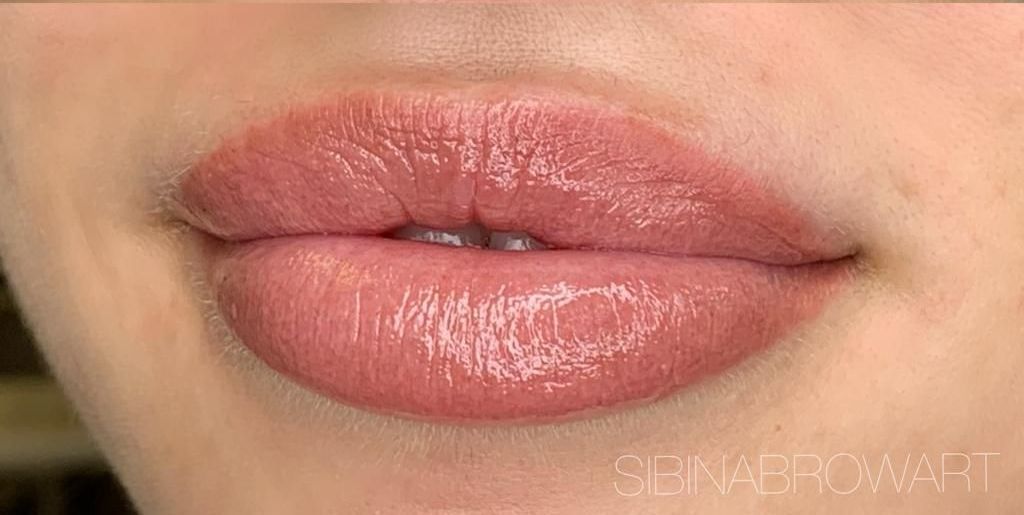 A close up of a woman 's lips with lipstick on them — Sibina Cosmetic Tattoo Art In Broadbeach, QLD