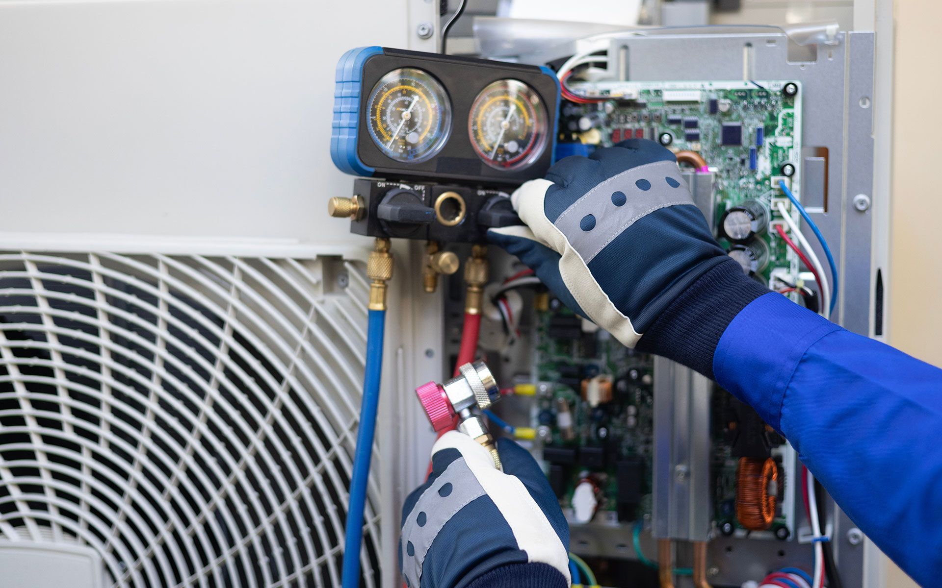 A man is working on an air conditioner.