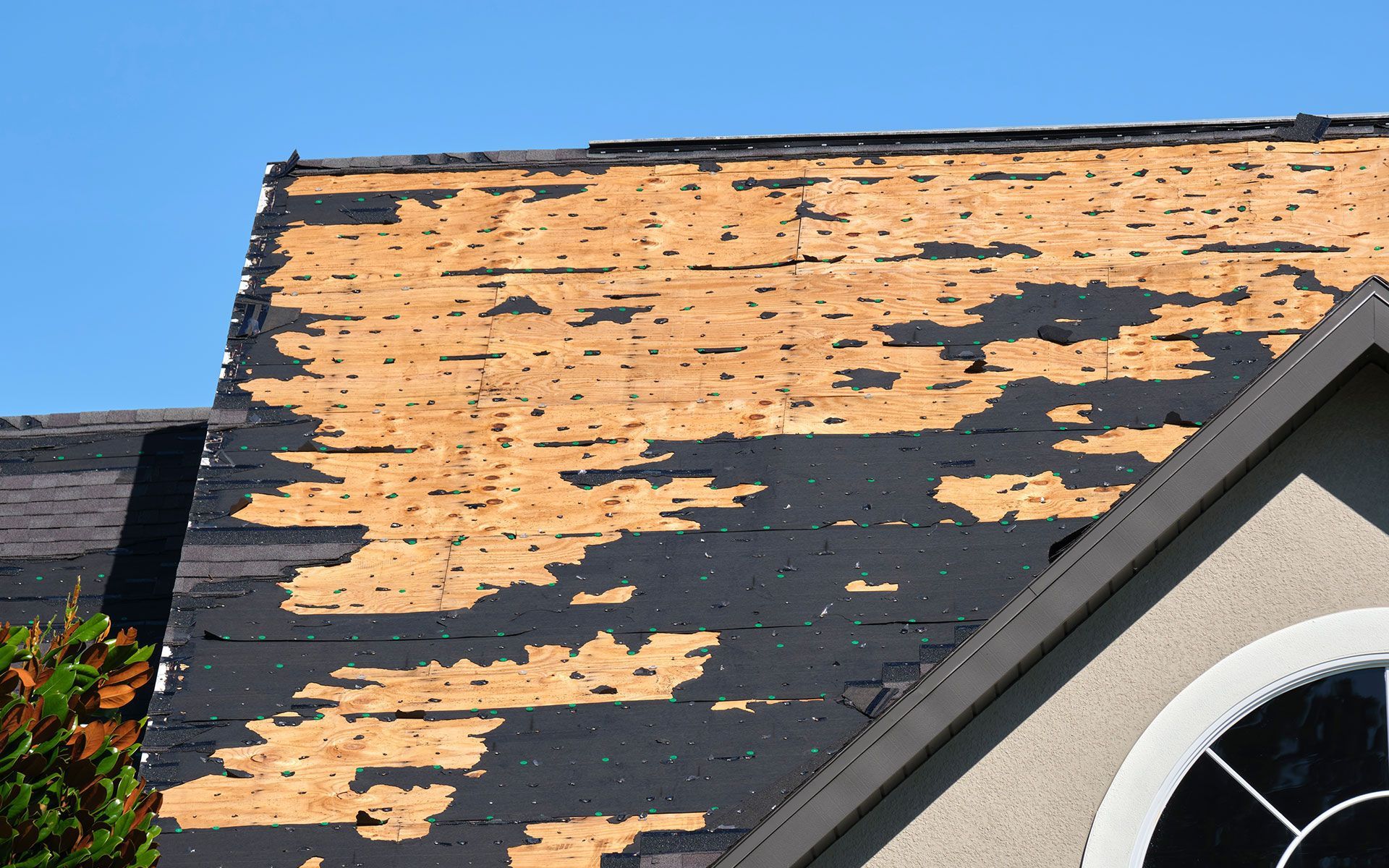 A house with a roof that is peeling off