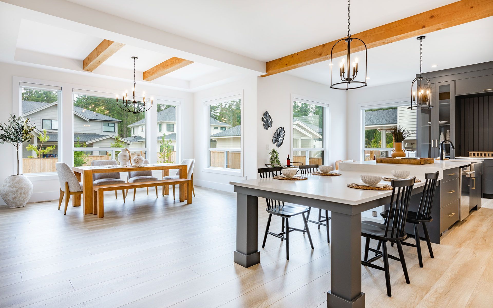 There is a dining room table and chairs in the middle of the room.