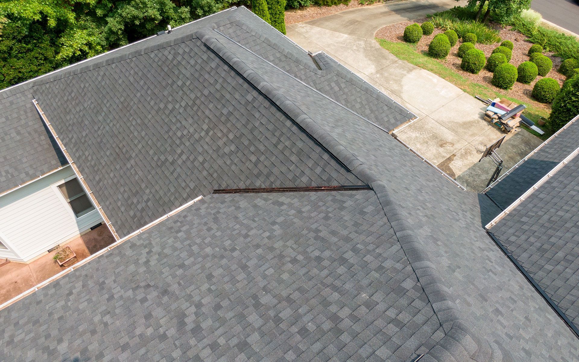 An aerial view of a roof of a house with a hole in it.