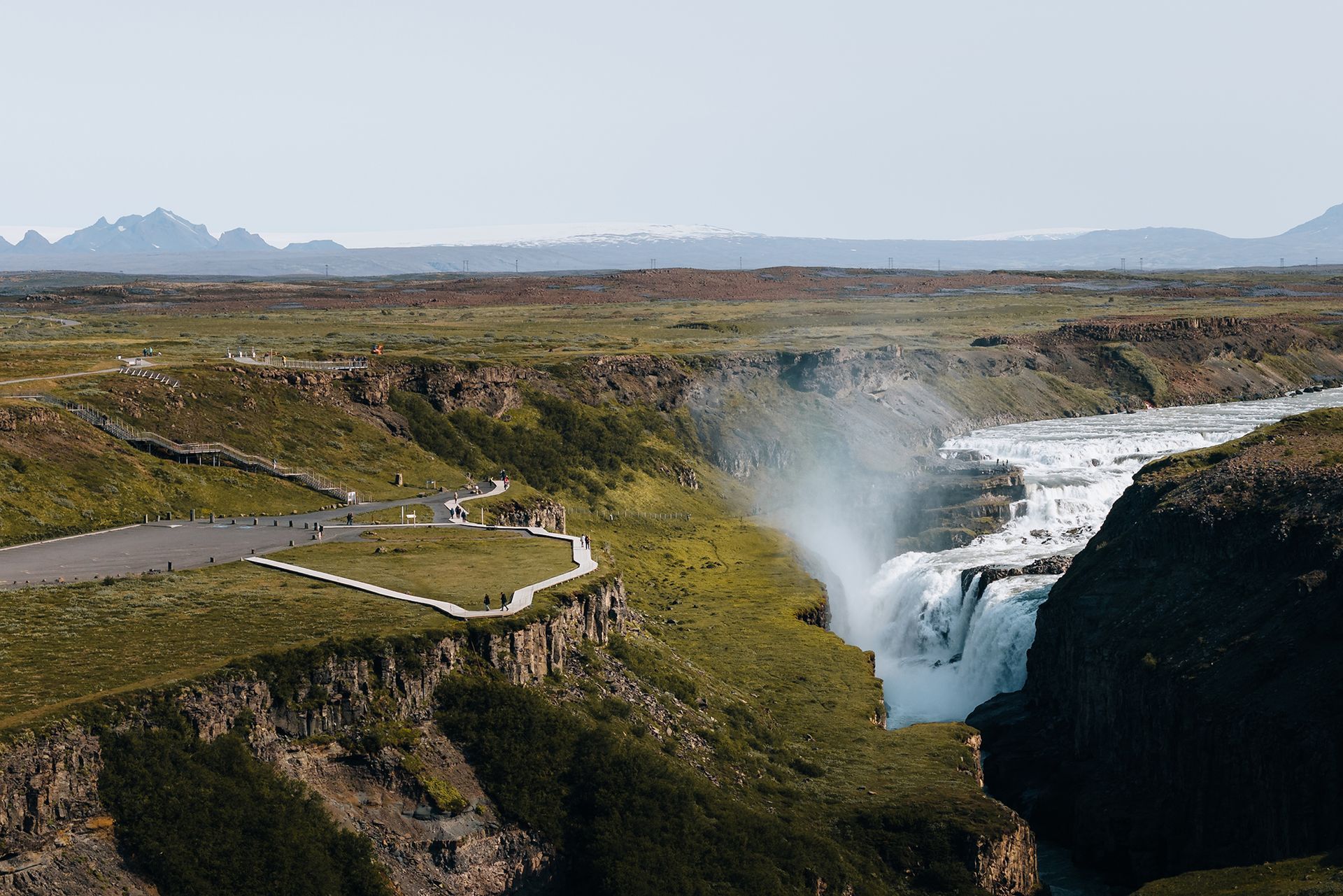 Waterfall Gullfoss viewed from a birds eye with the Icelandic highlands and Langjökull glacier in the background