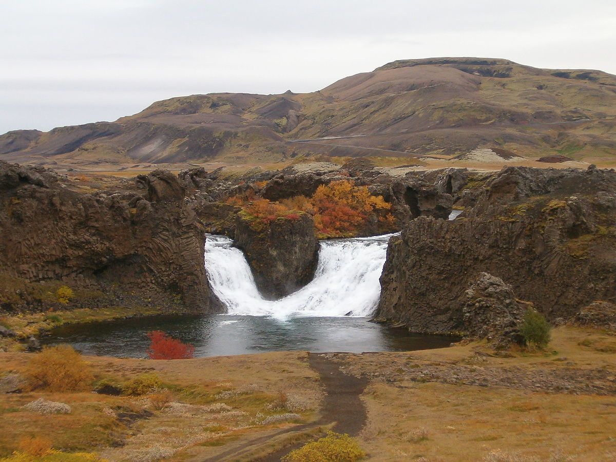 Hjálparfoss waterfall in autumn
