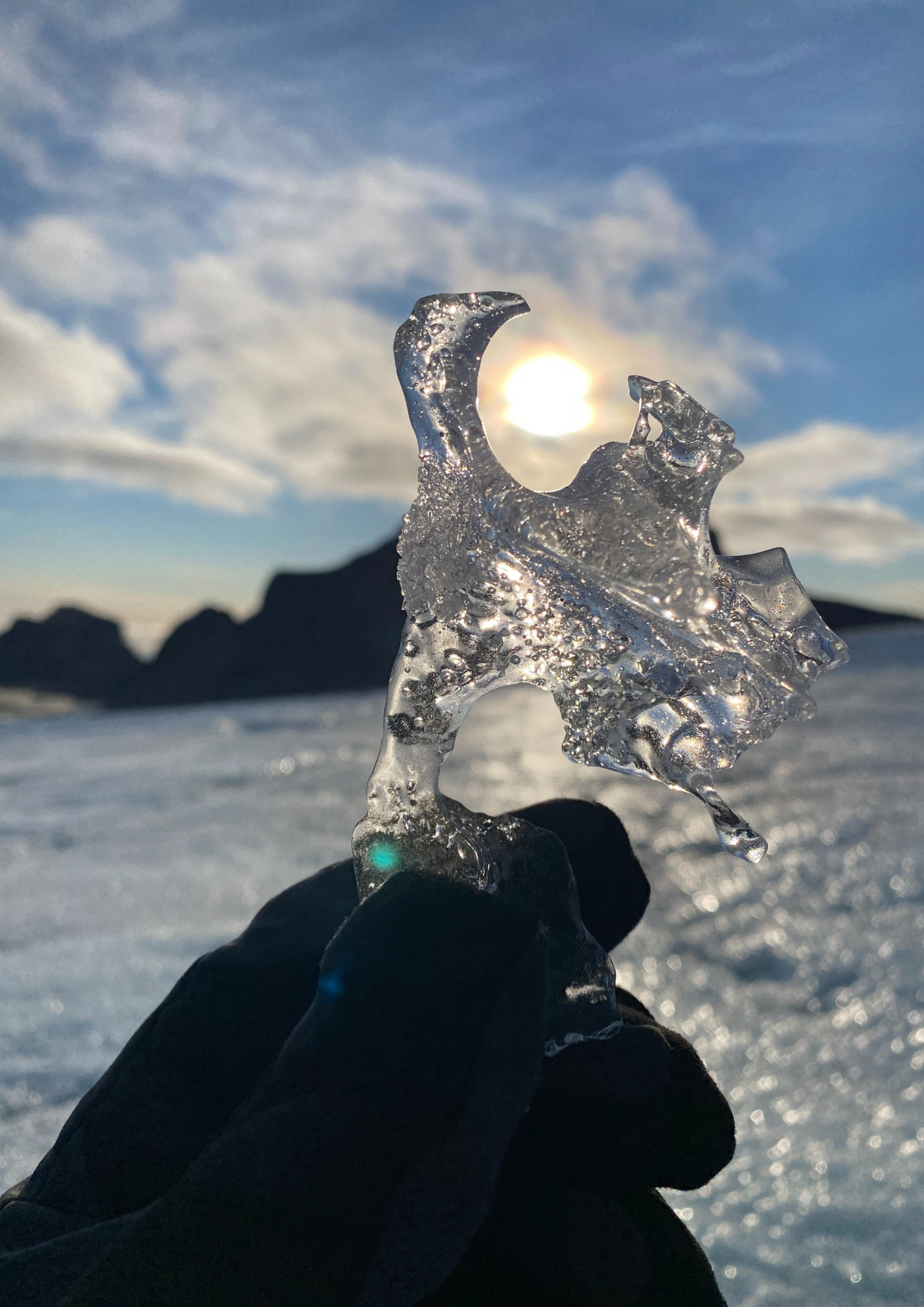 A piece of glacier ice capturing the low winter sun