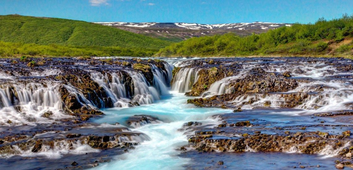 Brúarfoss watrfall with its deep blue colour 