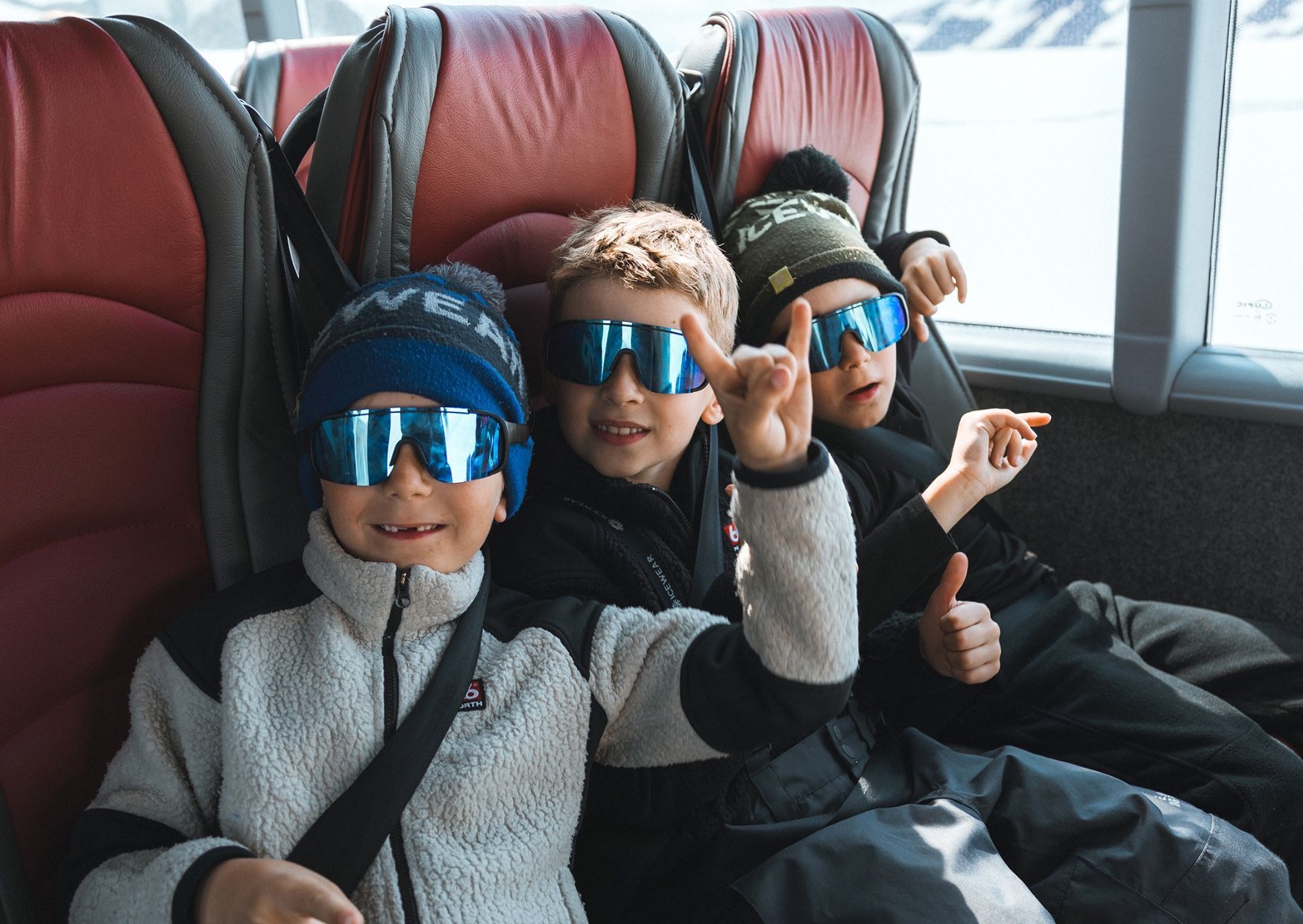 Children sitting in Sleipnir Monster truck enjoying the tour