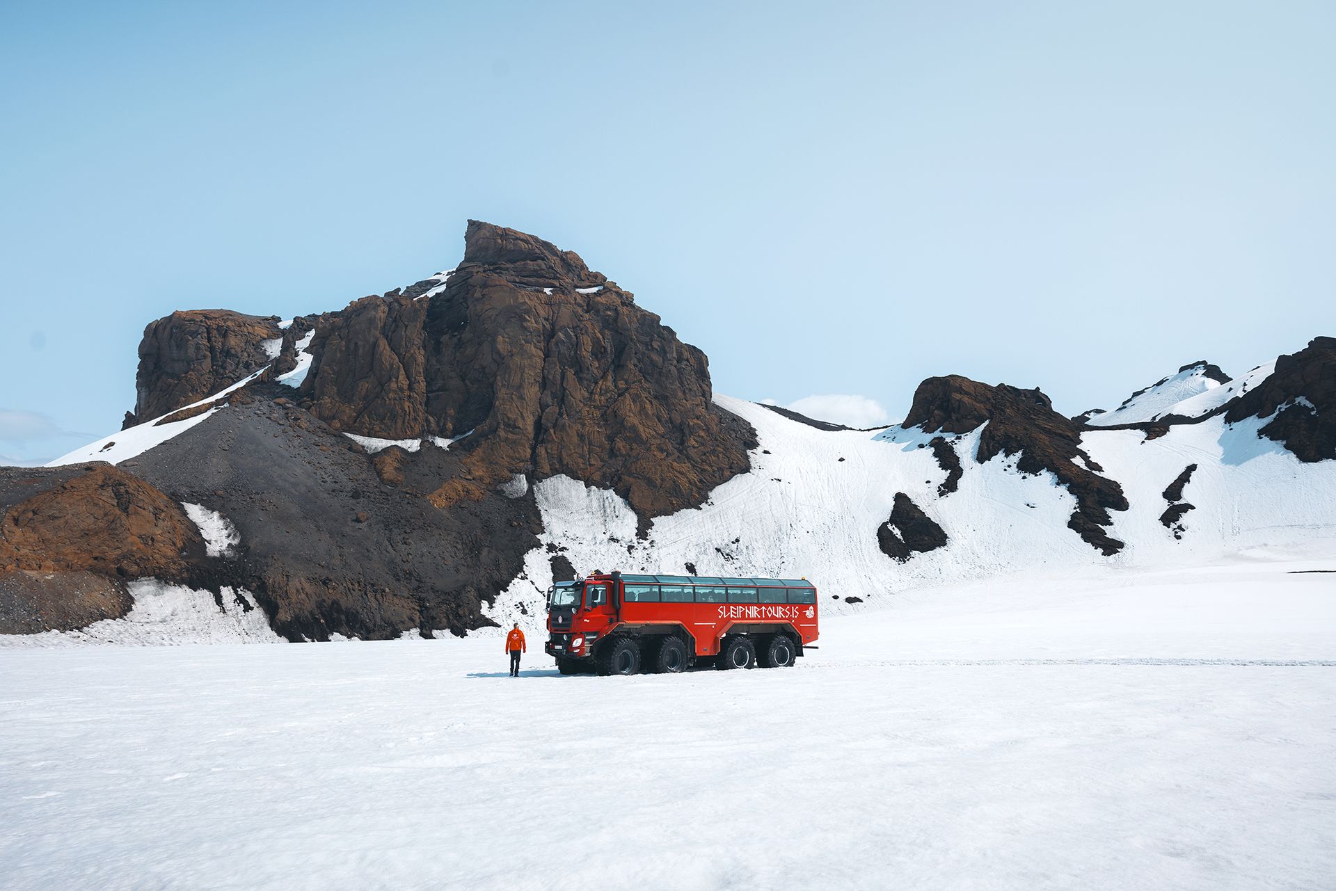 Monster Sleipnir glacier truck on Langjökull Glacier beneath the peak of Mount Jarlhetta, Iceland.