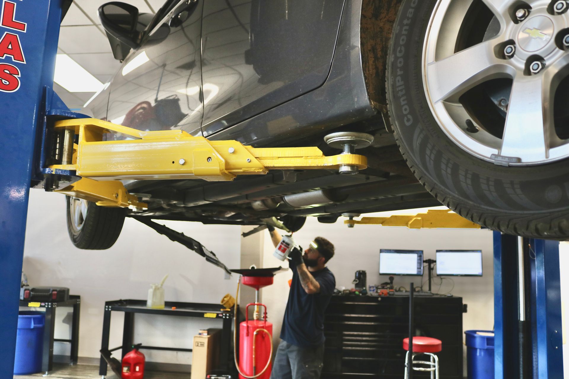 Car Propped Up with Jack | Best Mechanic in Pensacola, FL - Pensacola AC & Auto Service Center