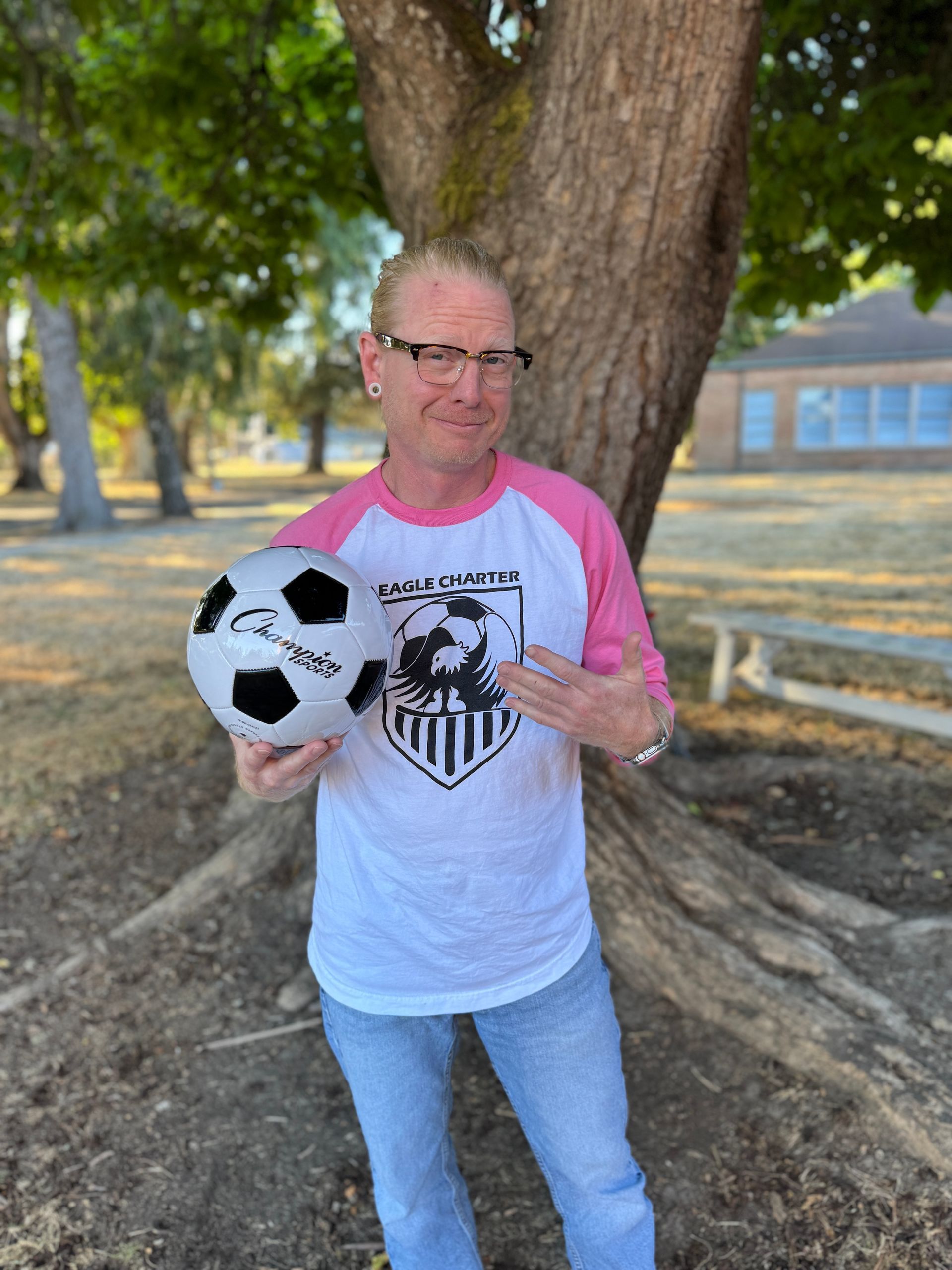 Technology Management. Holding a soccer ball.