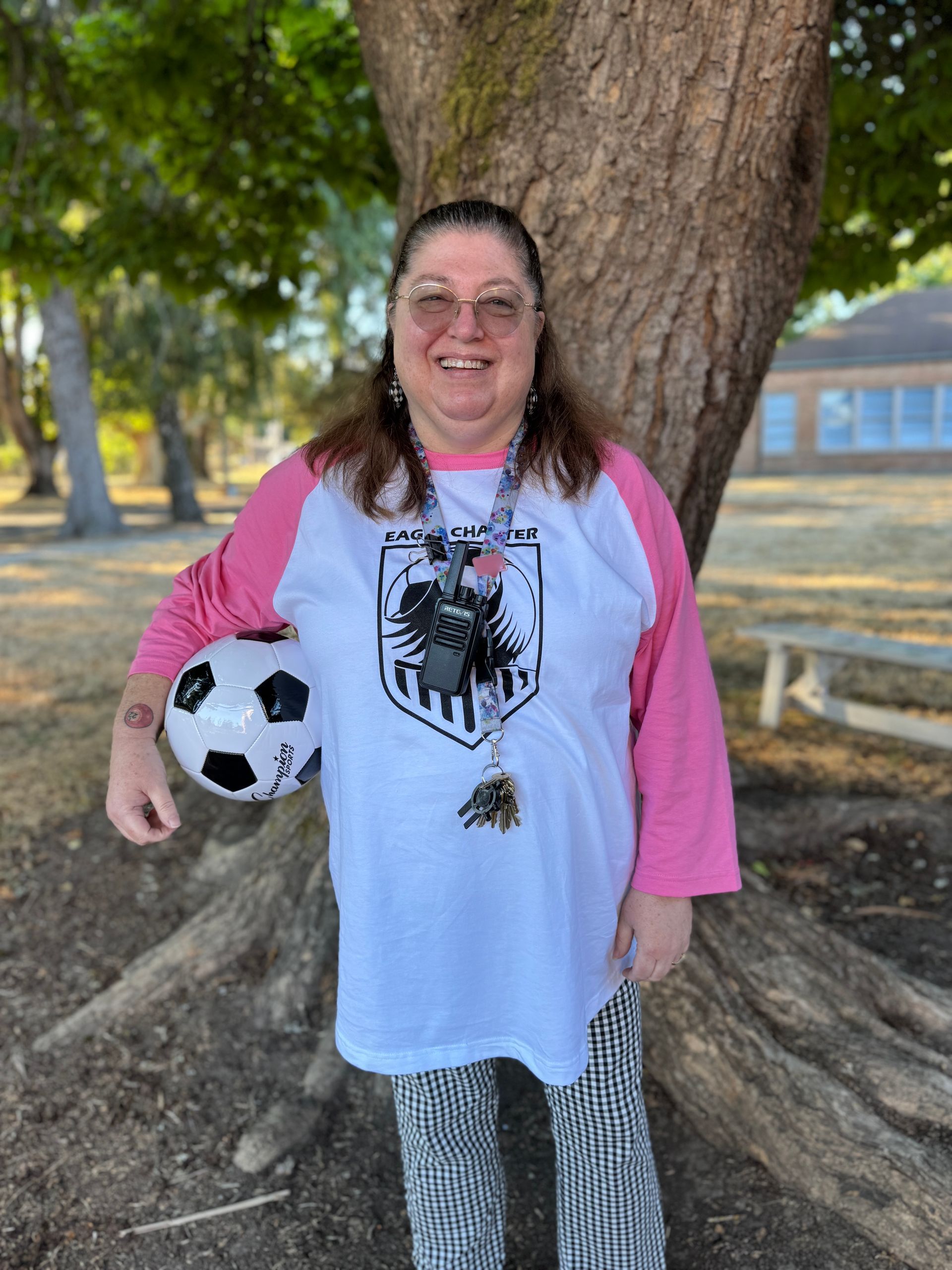 Office Manager. Holding soccer ball.