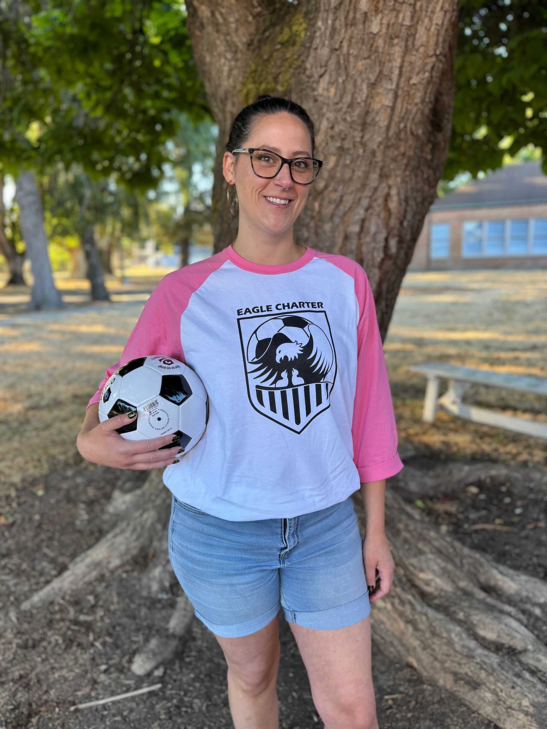 Interventionist. Holding a soccer ball.