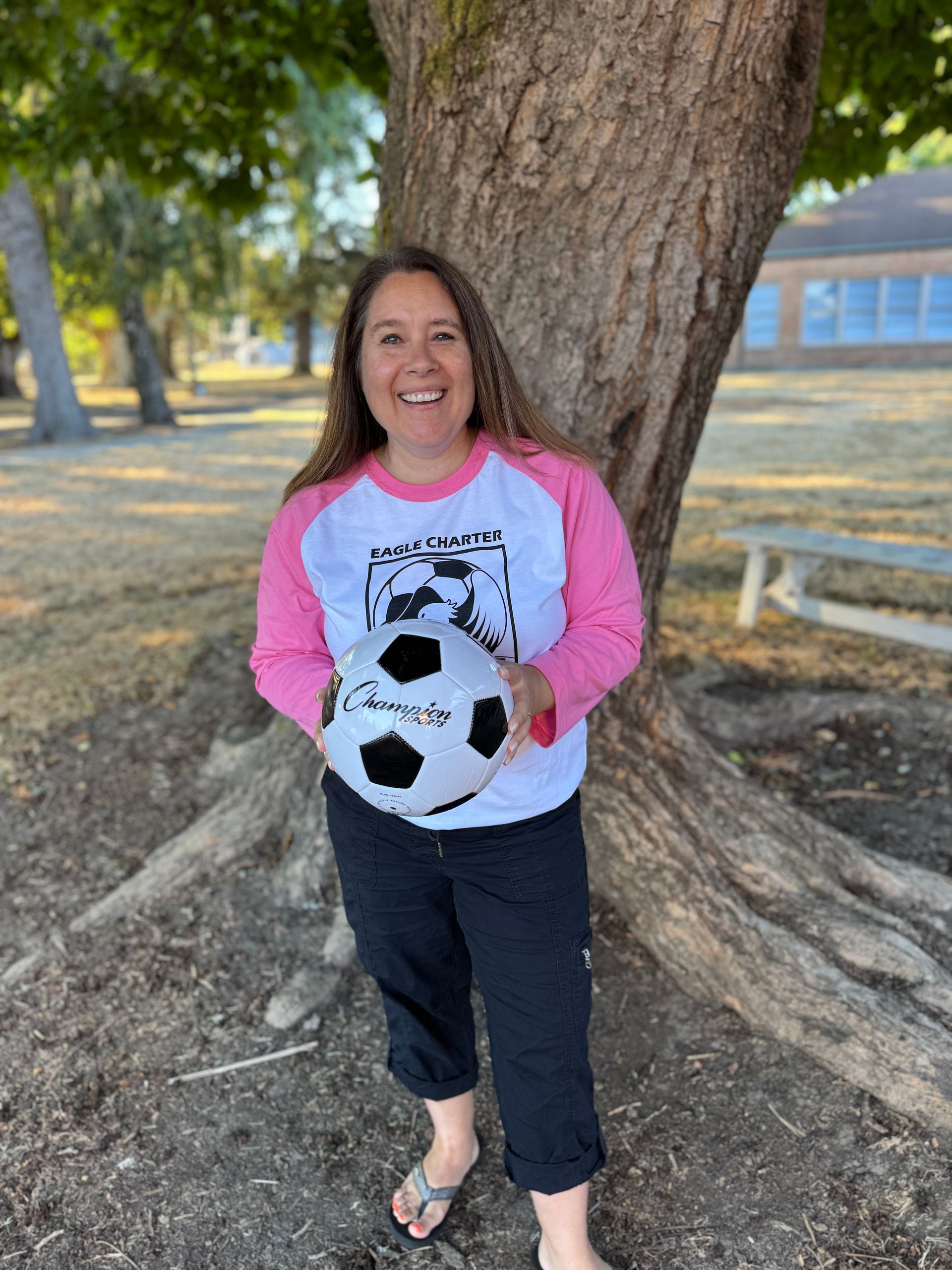 Fourth Grade Teacher. Holding a soccer ball.