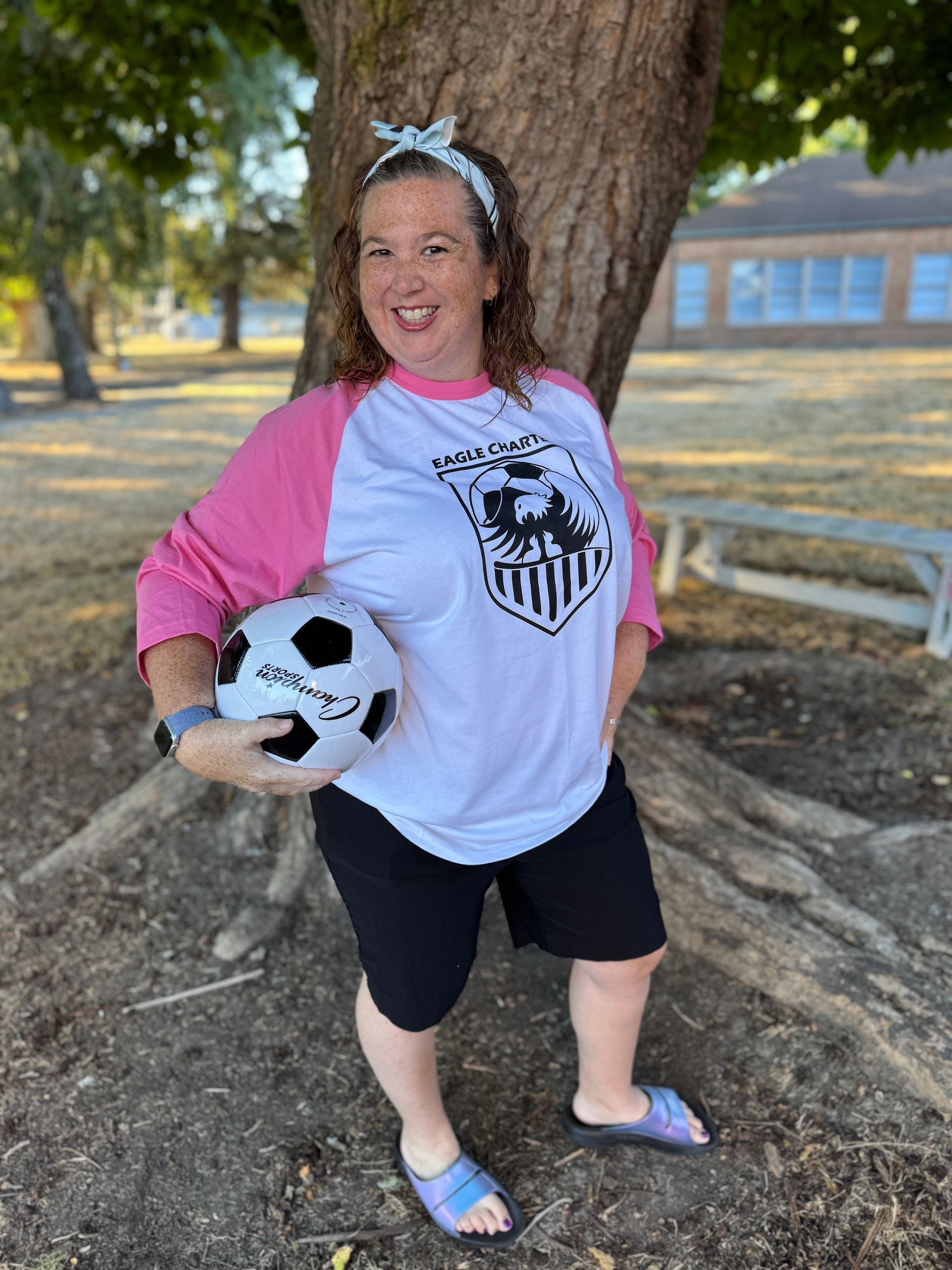 IA. Holding a soccer ball.
