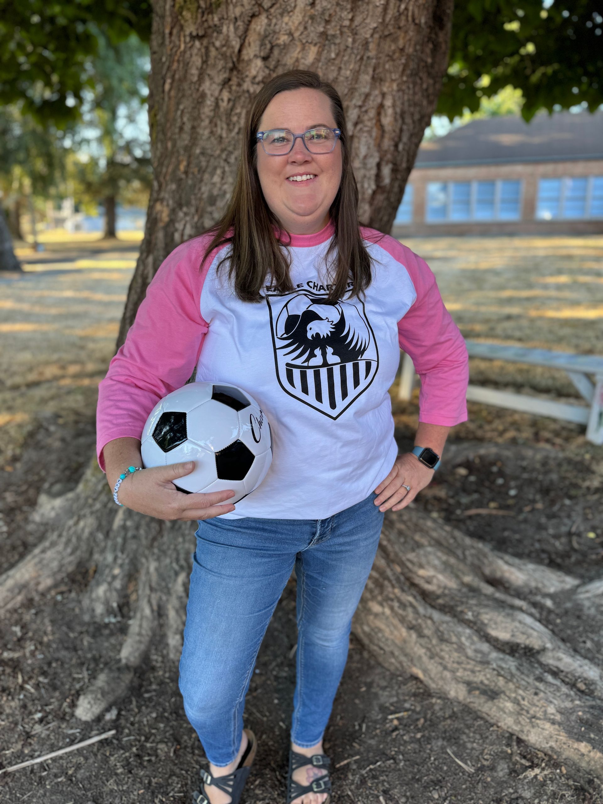 Kindergarten Teacher. Holding a soccer ball.