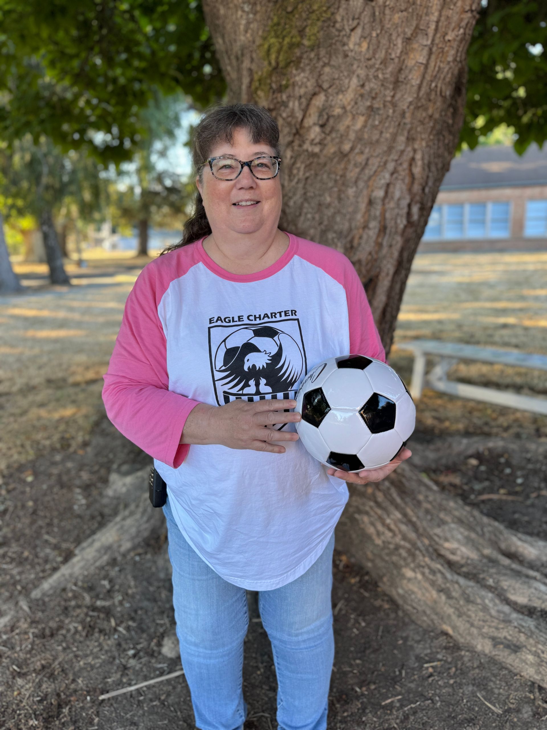 IA. Holding a soccer ball.