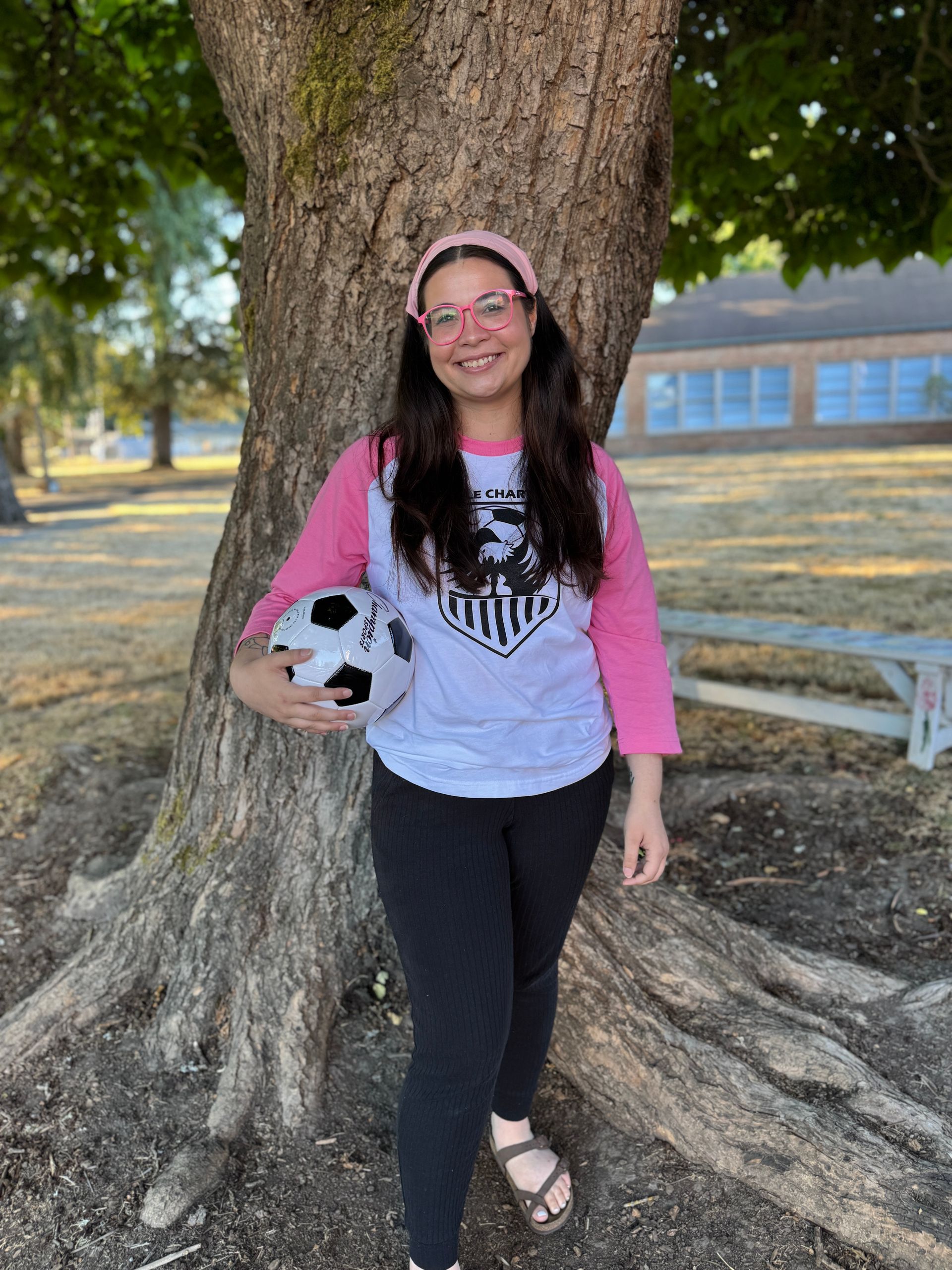 Third Grade Teacher. Holding a soccer ball.