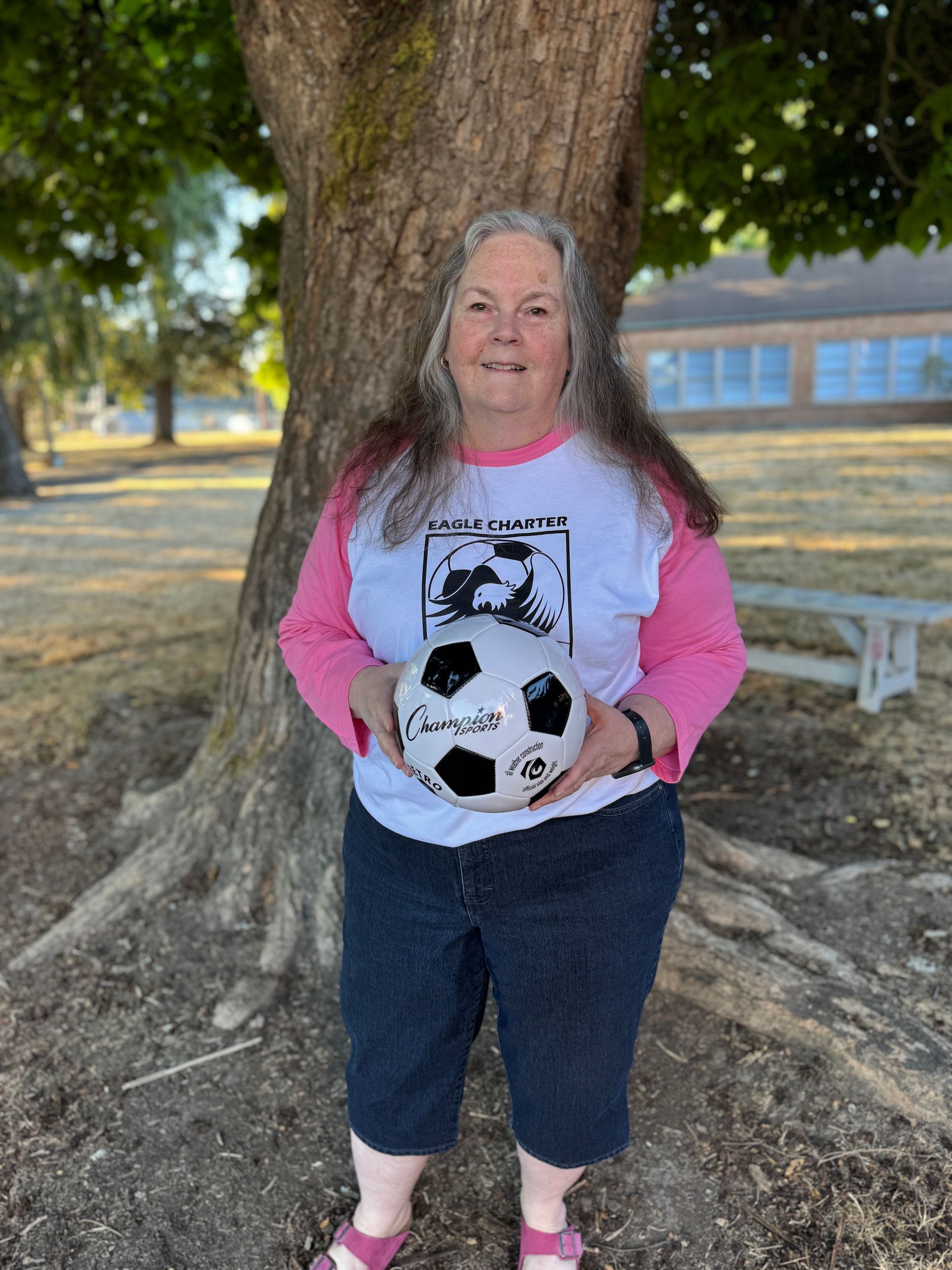 Interventionist. Holding a soccer ball.