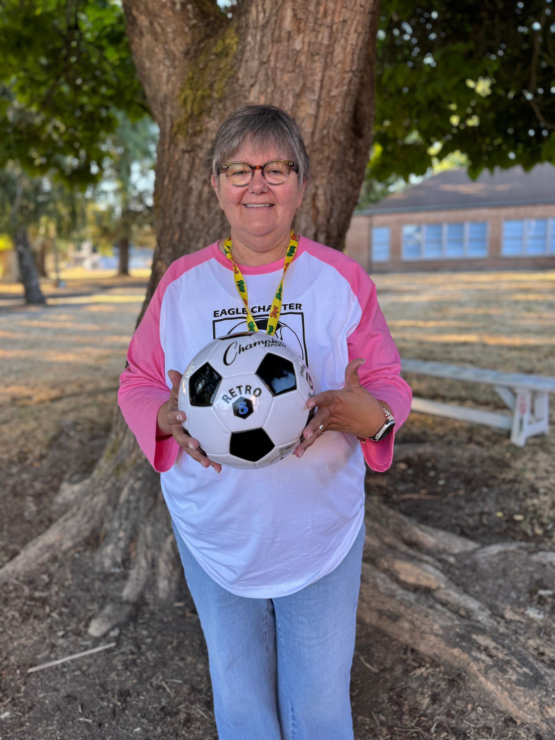 Second Grade Teacher. Holding a soccer ball.